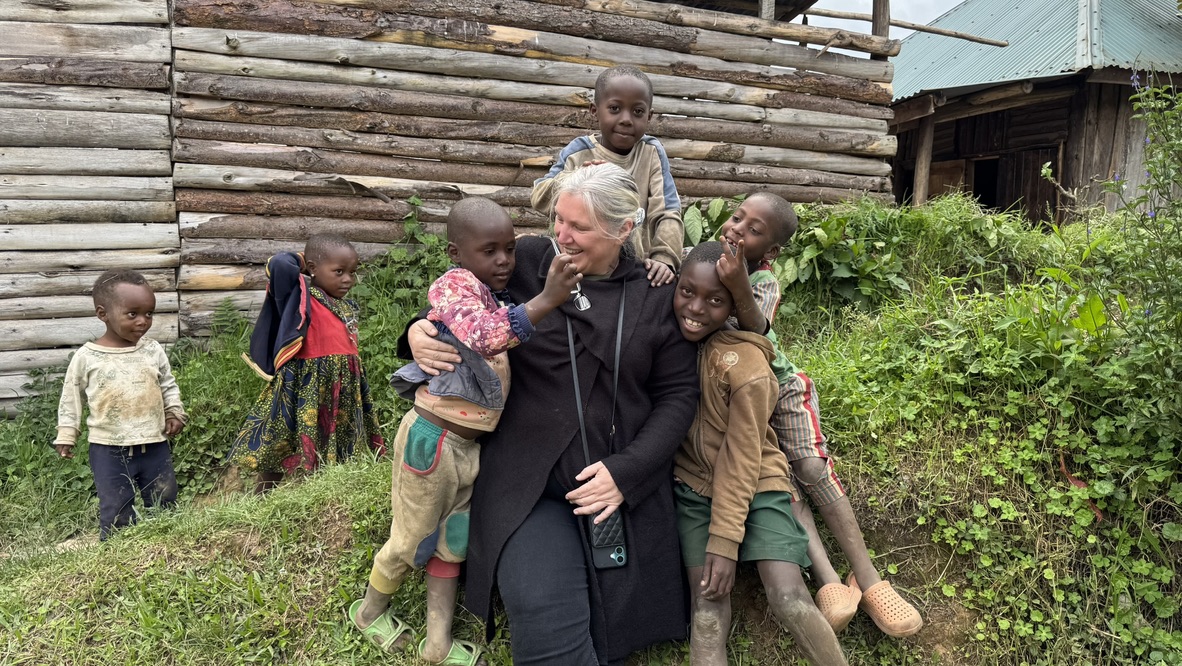 Lorraine Simpson meeting children in a Ugandan community