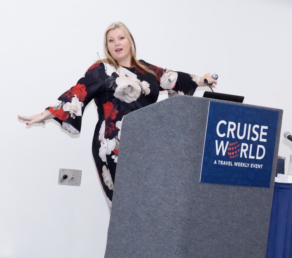 Lorraine Simpson speaking on stage at CruiseWorld