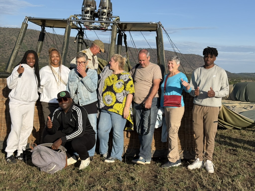 A group of travel professionals together after a hot-air-balloon experience in Tanzania